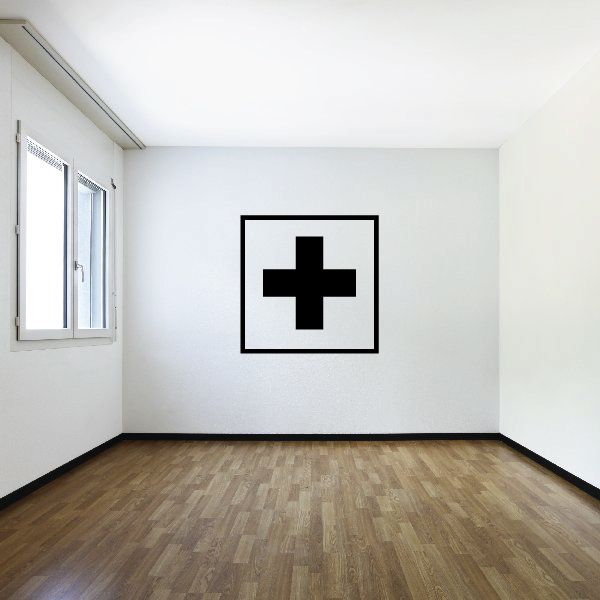 First aid kit wall decal with black medical cross icon in a square frame