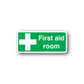 First aid room sticker, green with white cross and “First aid room” text
