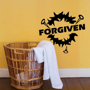 Forgiven wall decal with bold black letters and jagged paint-splash shape
