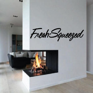 Wall decal with "Fresh Squeezed" in black cursive lettering
