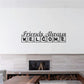 Wall decal text "Friends Always Welcome" in black on a light wall