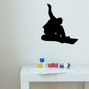 Snowboarding grab decal, black silhouette of rider in mid-air pose