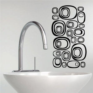 Futuristic pebbles wall decals set with black outlined oval and ring shapes
