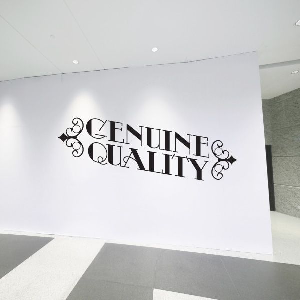 Vinyl wall decal, black Genuine & Quality lettering with swirls