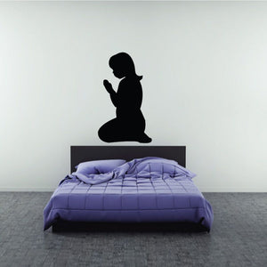 Praying girl wall decal silhouette above bed headboard