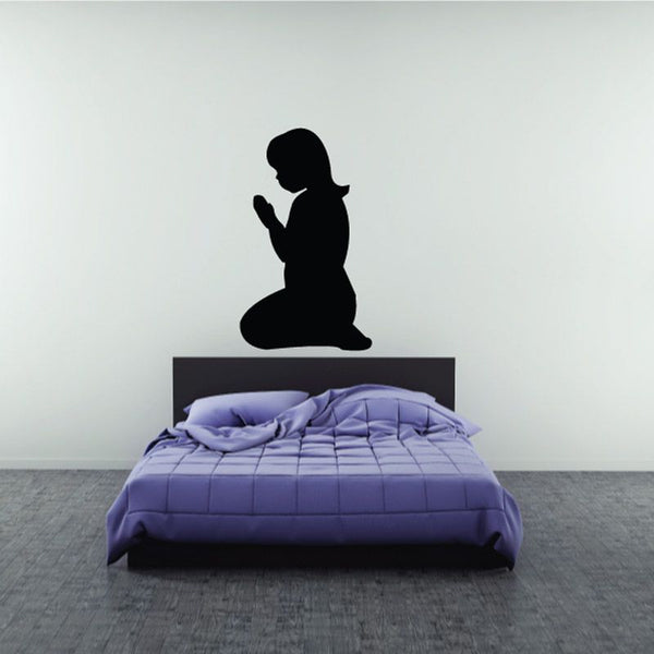 Praying girl wall decal silhouette above bed headboard