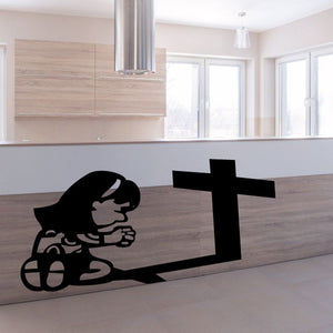 Religious wall decal of a praying girl with a large cross silhouette, black