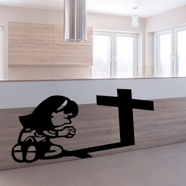 Religious wall decal of a praying girl with a large cross silhouette, black