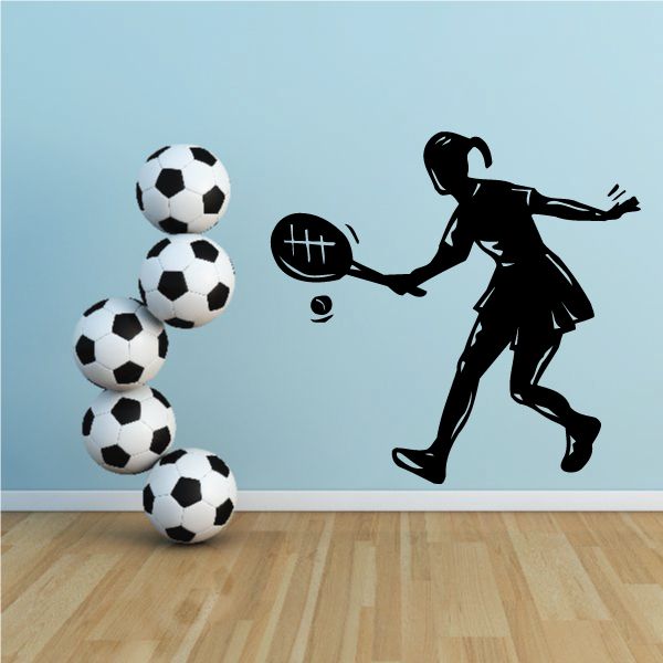 Girl tennis player wall decal with racket silhouette and black-and-white soccer balls