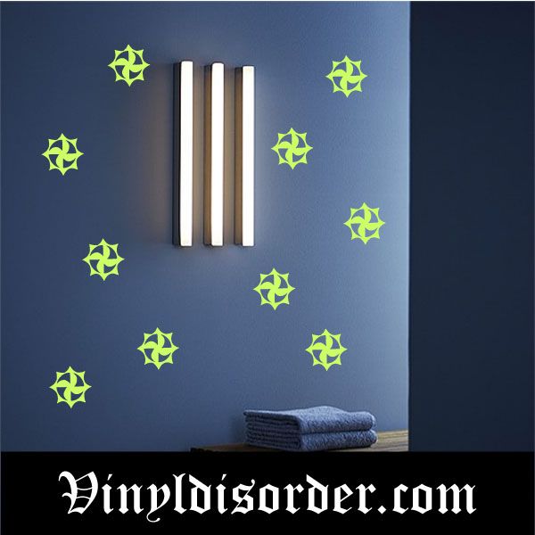 Glow-in-the-dark star decals, green swirling spiral centers on blue wall