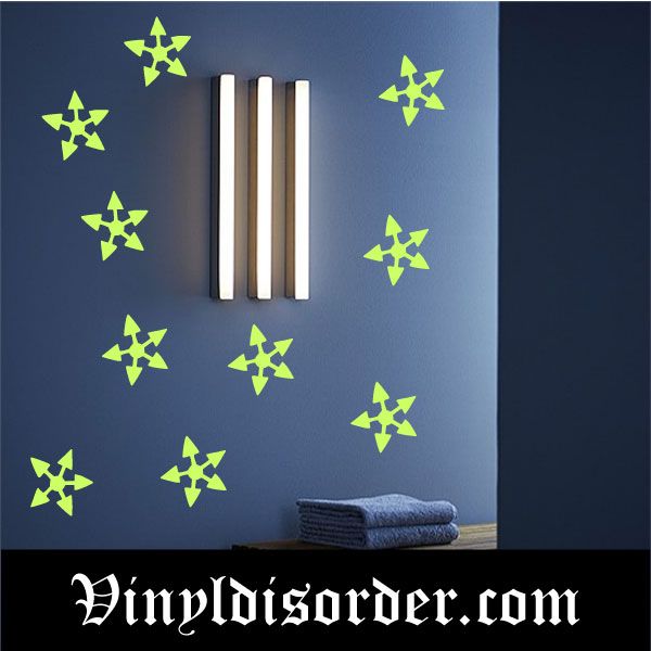 Glow-in-the-dark arrow star wall decals with multiple green star shapes