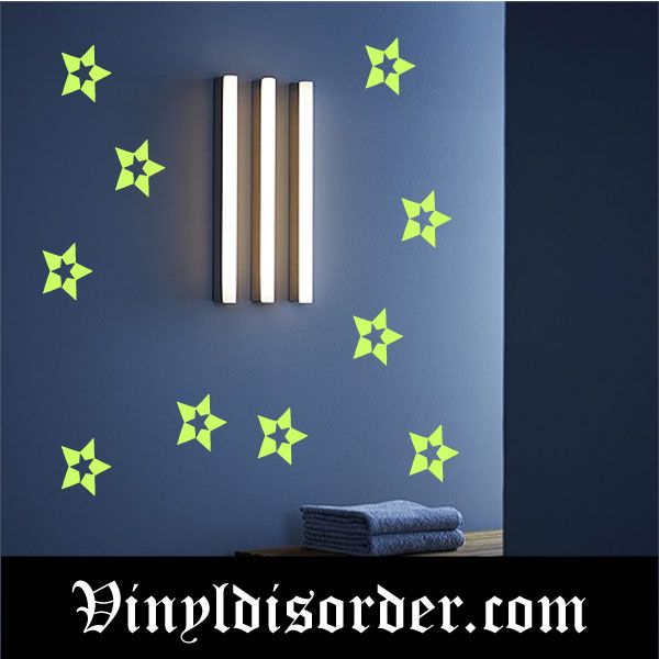Glow-in-the-dark star decal set with multiple neon green stars on a wall