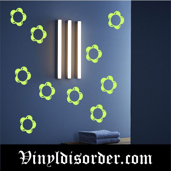 Glow-in-the-dark flower decal set, multiple green open flower outlines with dark centers.