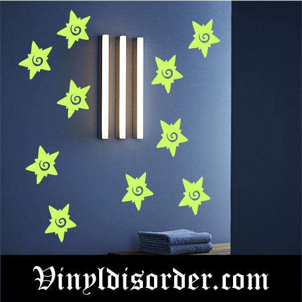 Glow-in-the-dark starburst decals, neon green eye-centered shapes