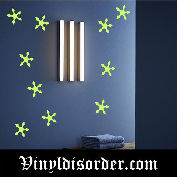 Glow-in-the-dark starburst wall decals with neon green asterisk shapes