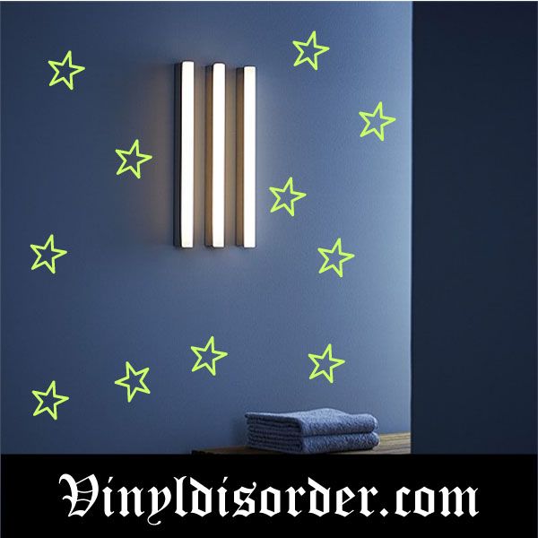 Glow-in-the-dark star decals with lime green outlined stars on blue surface