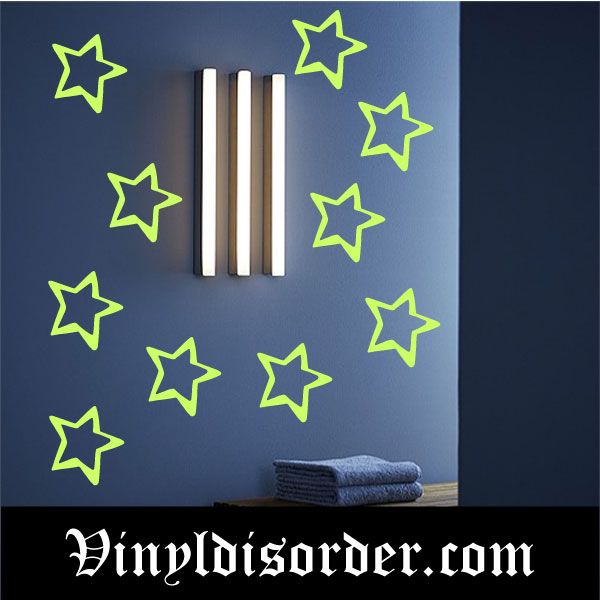 Star glow-in-the-dark decal with neon green doodle outlines on dark blue wall