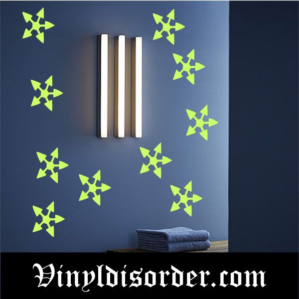 Glow-in-the-dark arrow pointed star decals, green stars on a blue wall