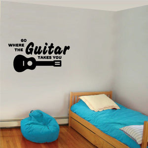 Black wall decal with guitar icon and quote text