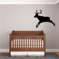 Black reindeer wall decal in mid-leap with antlers