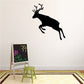 Leaping reindeer wall decal, black silhouette with antlers and raised leg.