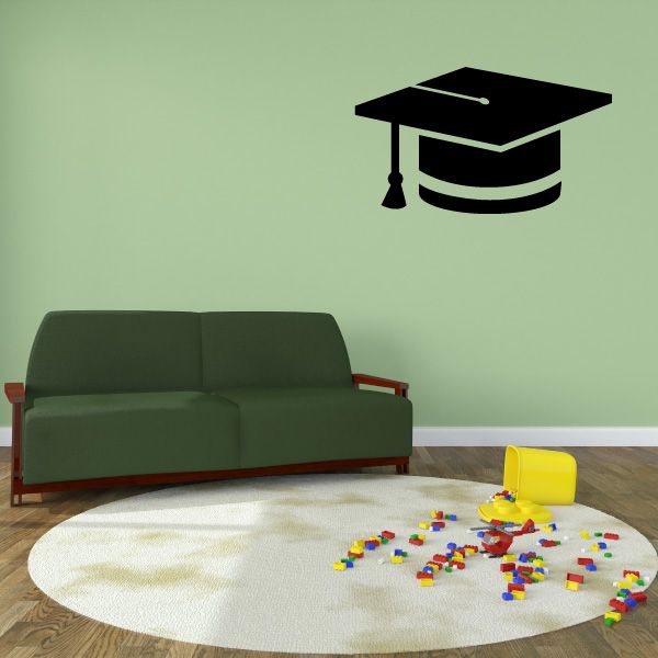 Graduation cap wall decal with black cap, tassel, and white striped band