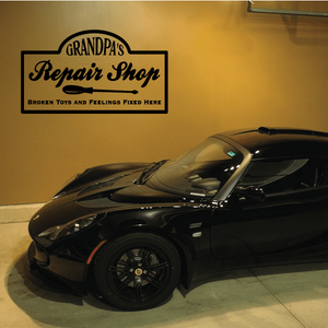Black wall decal reading "Grandpa's Repair Shop" with "Broken Toys and Feelings Fixed Here"