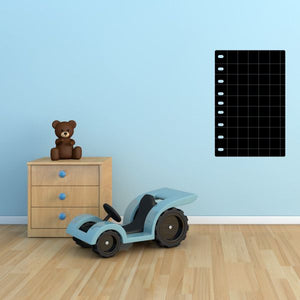 Black graph-paper style wall decal with white grid lines and margin ticks
