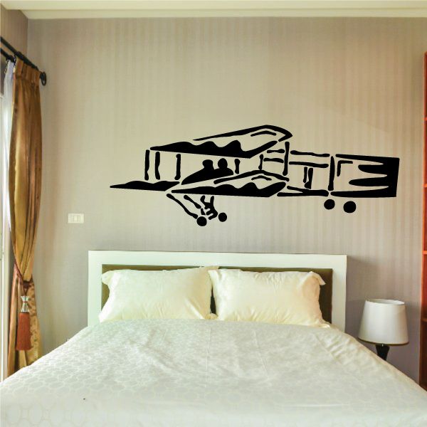 Black stylized airplane wall decal with silhouettes and wheels