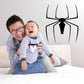Black spider wall decal with legs spread, centered on a white surface.