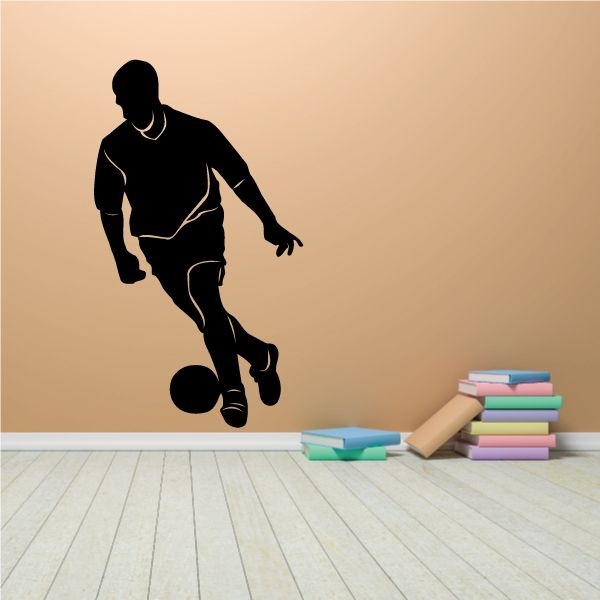 Soccer player wall decal: black silhouette dribbling a soccer ball