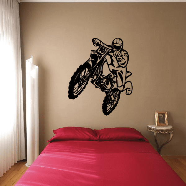 Dirt bike decal of a man falling from a motocross bike, bold black design