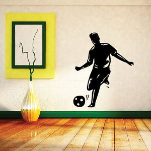 Soccer player wall decal showing a man kicking a soccer ball in black silhouette