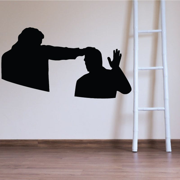 Prayer decal featuring a black silhouette of a person with hands raised to the head.