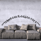 Black cursive wall decal: 'Happiness resides here'