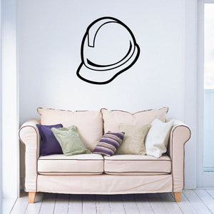 Hard hat decal sticker with black outline on a white wall