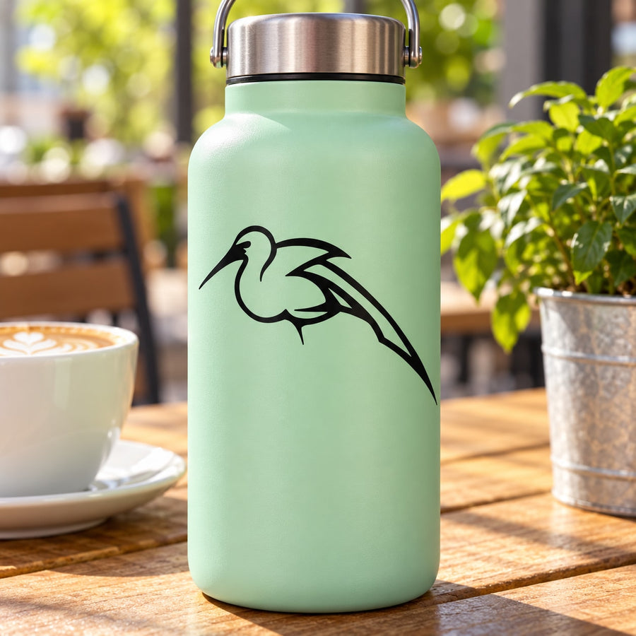 Black swooping heron decal on a mint-colored water bottle
