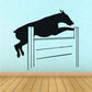 Black dog jumping hurdle wall decal with two vertical posts and rails
