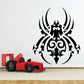 Black hollow swirl spider wall decal with ornate filigree legs
