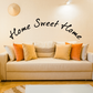 Curved wall decal with black cursive 'Home Sweet Home' text