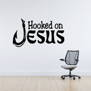 Black "Hooked on Jesus" wall decal with hook icon