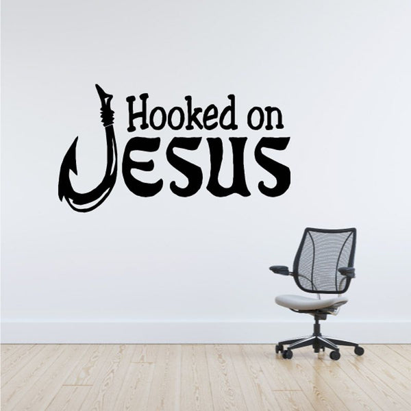 Black "Hooked on Jesus" wall decal with hook icon