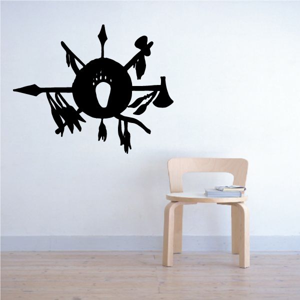 Black wheel-style wall decal with spoked rays and hanging banner shapes