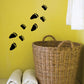 Bear paw track decal with scattered black paw prints