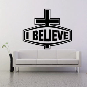 Black cross wall decal with 'I BELIEVE' lettering inside banner