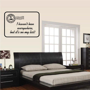 Wall quote decal with circular stamp and cursive text on a dark-bordered card
