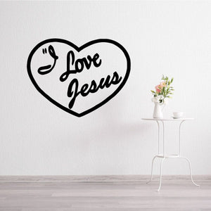 Heart-shaped decal reading "Love Jesus" with praying hands symbol