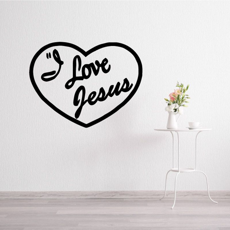 Heart-shaped decal reading "Love Jesus" with praying hands symbol