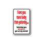 Rectangular wall decal sticker with red and black quote text, white border.