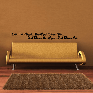 Wall decal with black moon-and-blessing lettering: 'I see the moon... God bless me'